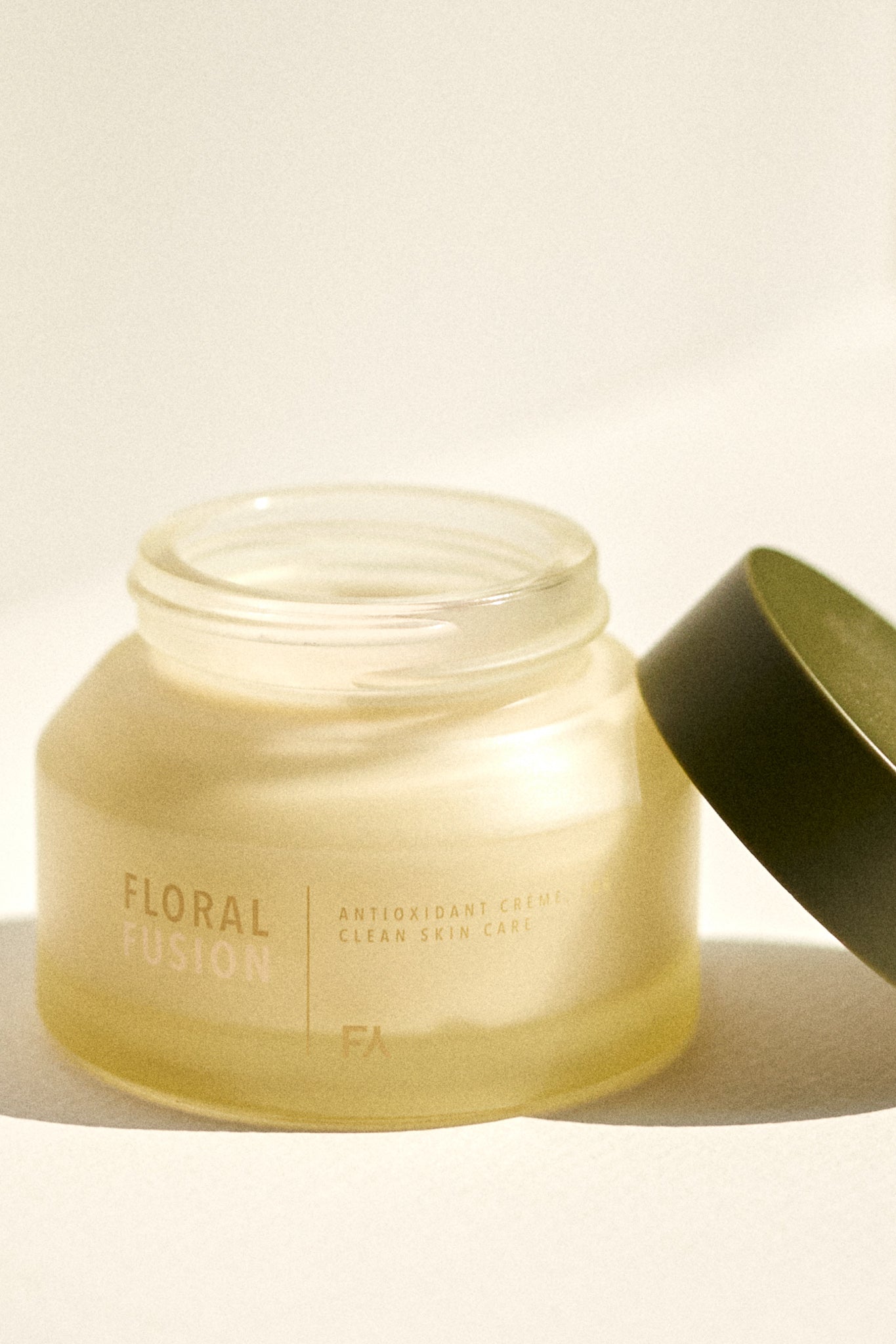Campaign picture of the Floral Fusion Antioxidant Cream by Fields of Yarrow jar opened